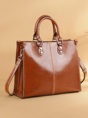 Stylish brown leather handbag on display