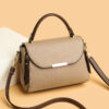 Stylish beige handbag with shoulder strap.