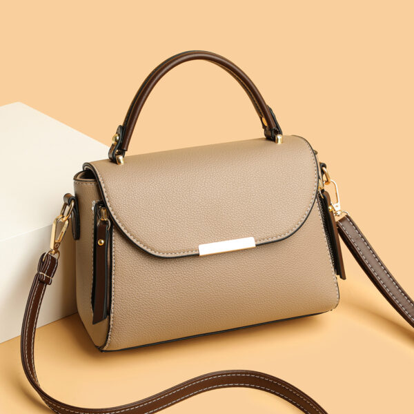 Stylish beige handbag with shoulder strap.